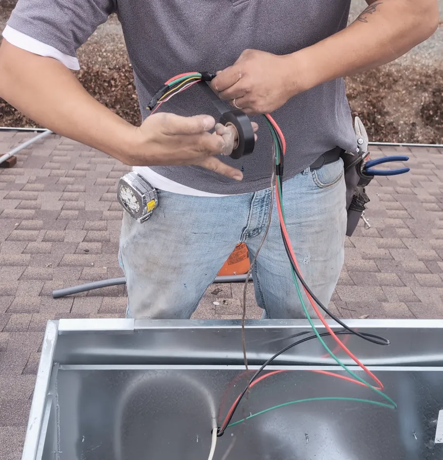 Tape the ends of the load wires and the thermostat wires together