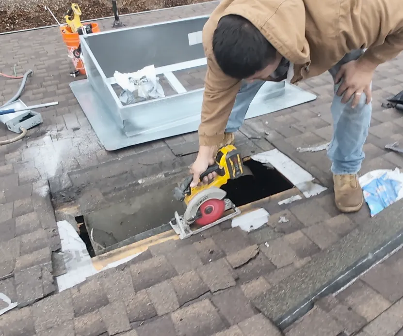 Cutting the roof sheathing/plywood to fit the new HVAC curb
