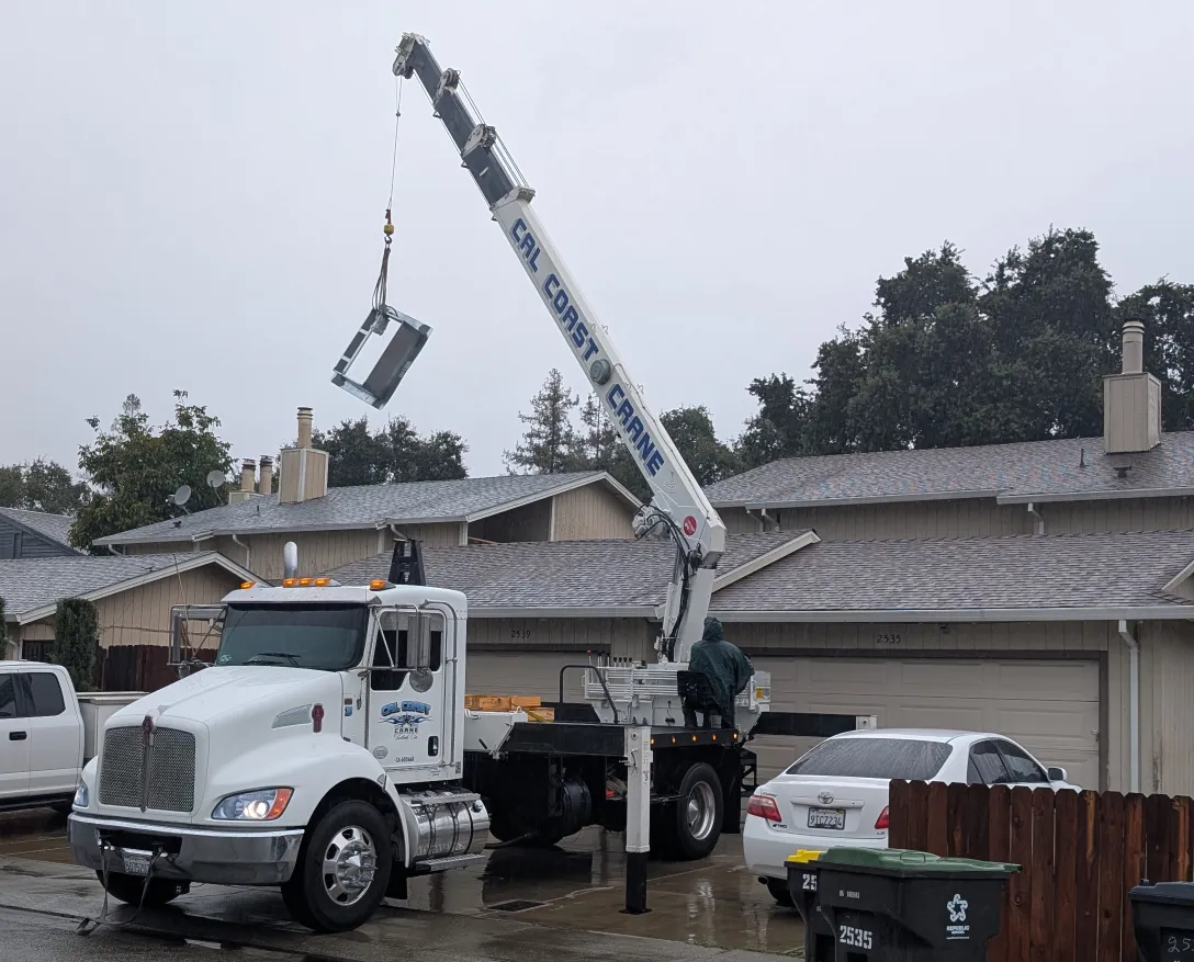 Used a crane to lift new curb onto roof