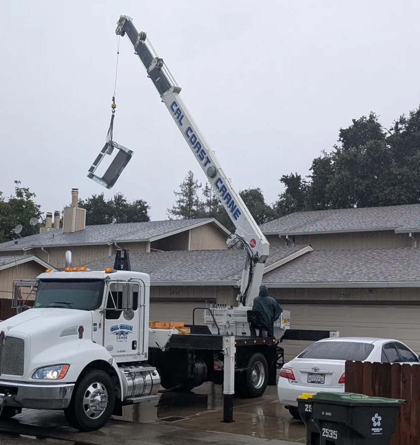 Used a crane to lift new curb onto roof