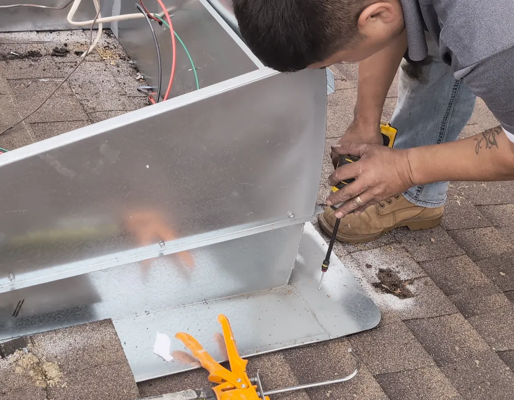 Screw the base of the curb into the roof at various places.